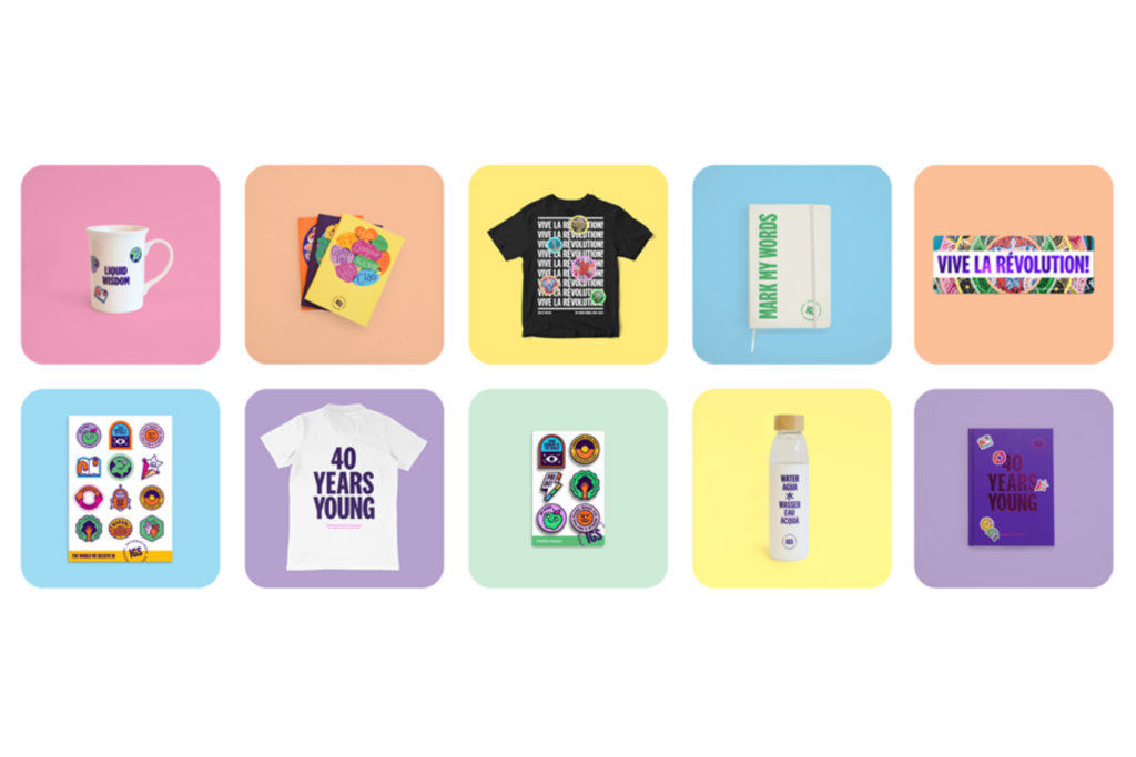Ten colourful product images on pastel backgrounds, including mugs, T-shirts, stickers, a notebook, a water bottle, and a banner with vibrant designs and positive messages.